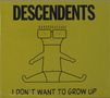 Text: "DESCENDENTS" und "I DON'T WANT TO GROW UP". Eine einfache Zeichnung einer dünnen Figur mit Brille.