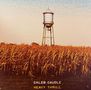 Text: "CALEB CAUDLE" "HEAVY THRILL". Illustration zeigt ein Wasserreservoir über einem goldenen Maisfeld unter blauem Himmel., LP