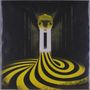 Eine gelbe Spirale zieht sich durch einen dunklen Tunnel. Oben befindet sich eine goldene, abstrahierte Skulptur., LP