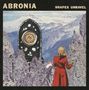 Oben steht "ABRONIA" und "SHAPES UNRAVEL". Eine Person in Rot blickt auf eine Berglandschaft mit einem großen Ornament., LP