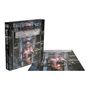 "Iron Maiden", "The X Factor", "500 Piece Puzzle". Illustration zeigt eine Figur in einer Metallumgebung, teils Puzzle, teils Box.