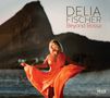 "DELIA FISCHER Beyond Bossa." Frau in orangefarbenem Kleid am Strand vor felsiger Landschaft. Logo unten rechts., CD