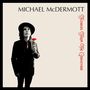 "MICHAEL McDERMOTT" oben, "Flowers From The Graveyard" rechts in Rot. Mann mit Hut hält rote Blume., CD