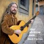 Text: "far driven sun, Buck Curran". Ein Mann lehnt an einer Stadtmauer und hält eine akustische Gitarre., CD