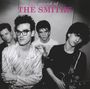 "the sound of THE SMITHS" steht oben in lila. Darunter vier Männer, einer hält eine Gitarre.