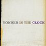 Text: "YONDER IS THE CLOCK". Hintergrund mit Vintage-Papierstruktur., 2 LPs