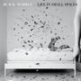 "BLACK/MARBLE LIFE IN SMALL SPACES" Oben, Konfetti wirbelt um liegende Person mit Buch auf Bett., CD