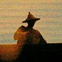 Dunkle Silhouette einer Person mit Spitzhut, die sich gegen einen orangefarbenen Hintergrund abhebt., LP