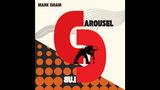 Text: "MARK ISHAM", "CAROUSEL", "CLUB". Illustration mit großen roten Formen und einer schwarzen, bassspielenden Figur., LP