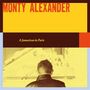 Text: "Monty Alexander", "A Jamaican in Paris". Ein Mann von hinten schaut auf ein Klavier., CD