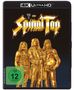 Aufschrift: "This is Spinal Tap". Drei goldene Figuren in Rockstar-Posen, auf schwarzem Hintergrund. 4K Ultra HD Logo oben.
