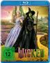 "Wicked Teil 2", FSK 12. Zwei Figuren: eine grüne Hexe in Schwarz und eine blonde Person in einem lila Kleid auf gelbem Weg., Blu-ray Disc