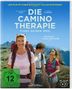 „Die Camino Therapie. Finde deinen Weg.“ Drei Personen mit Rucksäcken in einer bergigen Landschaft. FSK ab 12., 1 Blu-ray Disc und 1 DVD