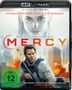 „MERCI“ in roter Schrift, darüber Gesichter von Chris Pratt und Rebecca Ferguson; Explosion und Hubschrauber im Hintergrund.