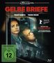 "Gelbe Briefe" in roten Buchstaben, Schauspieler, FSK 12 Hinweis. Zwei Personen sitzen nachdenklich in einem Zug.