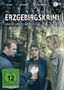 Titel: "Erzgebirgskrimi – Über die Grenze | Mordholz". Drei Personen im Wald, eine hält einen Gegenstand. Links ist ein FSK-Logo., DVD
