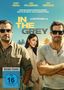 Text: "Henry Cavill", "Jake Gyllenhaal", "Eiza González", "Wenn Milliarden gestohlen werden...", "IN THE GREY", "Ein Guy Ritchie Film", "Vorab-Cover", "FSK ab 16 freigegeben". 

Zwei Männer in Sonnenbrillen und eine Frau im Hintergrund, Palmen im Hintergrund., DVD