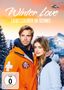 „Winter Love: Liebeszauber im Schnee“. FSK 0. Ein Paar in Winterkleidung vor verschneiten Bergen und Sonnenuntergang., DVD