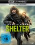 Aufschrift: "4K ULTRA HD", "JASON STATHAM", "SHELTER". Ein Mann und eine Frau rennen an einem Strand. FSK 16 Logo., Ultra HD Blu-ray