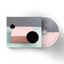 CD mit Texten: "ENDLESSLY", "BREAK BREAD", "ELEVENT HURTS". Daneben ein rosa Quader mit schwarzen Kreisen., CD