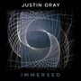 Text: "Justin Gray" oben, "Immersed" unten. Komplexe Linienmuster bilden ein gekrümmtes Gitter auf dunklem Hintergrund., 1 Blu-ray Audio und 1 CD