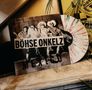 Auf einem Albumcover steht „BÖHSE ONKELZ MEXICO“. Es zeigt vier Personen in Ponchos und Sombreros. Eine bunte Schallplatte ist sichtbar., LP