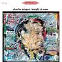 "charlie mingus: tonight at noon" steht oben. Darunter eine bunte, abstrakte Porträtillustration eines Gesichts., LP