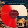 "ELVIS & FRIENDS Christmas at Graceland" steht auf einem zweifarbigen Vinyl. Weihnachtsdekor und ein Haus im Hintergrund.