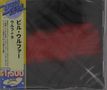 Japanischer Text: "Disco", "Wolf+9", "¥1,500". Ein gelber Streifen links, dunkel und rot im Hintergrund., CD