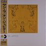 Texte: "ON JUPITER", "Sun Ra", Japanische Schriftzeichen. Illustration: Mensch mit ausgestreckten Armen, umgeben von Maskenmotiven.
