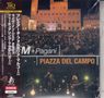 Texte: "Piazza del Campo", "M + Pagani". Menschenmenge vor einer beleuchteten Bühne mit historischem Gebäude im Hintergrund., 1 CD und 1 DVD