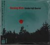 "Burning Wick Satoko Fujii Quartet" in Rot und Schwarz. Silhouette von Bäumen vor einem roten Kreis auf grünem Hintergrund., CD