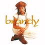 Text: "brandy" in gelber, verspielter Schrift. Eine Frau sitzt entspannt, trägt braune Kleidung und schaut freundlich., CD