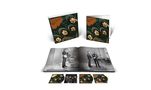 "Rubber Soul" steht in orange Schrift auf zwei Albumcovers, darunter ein offenes Buch mit Bildern und weitere Cover.
