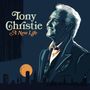 Text: "Tony Christie A New Life". Illustration eines lächelnden Mannes vor Skyline und orangefarbenem Mond im Hintergrund., LP