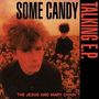 Texte: "Some Candy Talking E.P.", "The Jesus and Mary Chain". Zwei Männer in einem Feld, rot-schwarz gefärbte Szene., LP