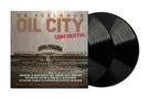 DR. FEELGOOD, OIL CITY CONFIDENTIAL. Zwei Schallplatten, grauer Hintergrund, Gebäude in der Mitte., 2 LPs