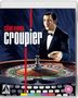 Text: "clive owen croupier". Illustration eines Mannes im Smoking vor einem Roulettetisch, darunter eine Schreibmaschine., Blu-ray Disc