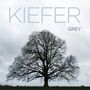 "Kiefer Sutherland, GREY" in großen Buchstaben. Ein kahler Baum unter grauem Himmel, ruhig und imposant., CD