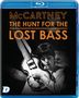 "McCARTNEY THE HUNT FOR THE LOST BASS" in orangen Lettern, schwarz-weißes Foto eines Musikers mit Bass auf einer Blu-ray-Hülle.
