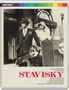 „STAVISKY“ in roter Schrift. Bild: Mann und Frau in eleganter Kleidung neben einem Oldtimer-Rolls-Royce.