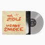 Cover mit orangefarbenem Text "The Spyrals Heavy Smoke". Eine graue Vinylplatte liegt daneben., LP