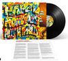 Bunte Collage mit großem Text "HAPPY MONDAYS PILLS 'N' THRILLS". Schallplatte daneben. Ein Infoblatt liegt darunter., LP