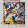 Text: "THE FABULOUS THUNDERBIRDS" oben, "TUFF ENUFF" unten. Bunte Collage mit Totemfiguren und Dekorationen., LP