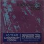 „Tuxedomoon Desire“ oben, 45 Jahr Jubiläumsedition in Blau. Hintergrund: abstraktes Muster in Lila und Blau., CD