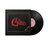 Roter Text "The Cribs", goldener Schriftzug "Insoles" auf einem schwarzen Plattencover, Vinyl-Schallplatte sichtbar., LP