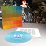 Texte: "A Certain Ratio", "The Joy of Selexat". Vordergrund: hellblaue Schallplatte, Hintergrund: Musikerfotos., LP