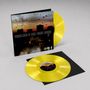 Text: "Bohren & der Club of Gore | Sunset Mission". Gelbe Schallplatten und ein Cover mit regnerischem Stadtbild bei Sonnenuntergang., 2 LPs