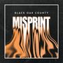 "Black Oak County" oben, "MISPRINT" groß in verzerrter Schrift. Dunkler Hintergrund mit verzerrten orangefarbenen Wellen., LP