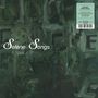 „Selene Songs“ in weißer Schrift auf einem dunkelgrünen, abstrakten Hintergrund mit einem infoboxartigen Feld rechts.